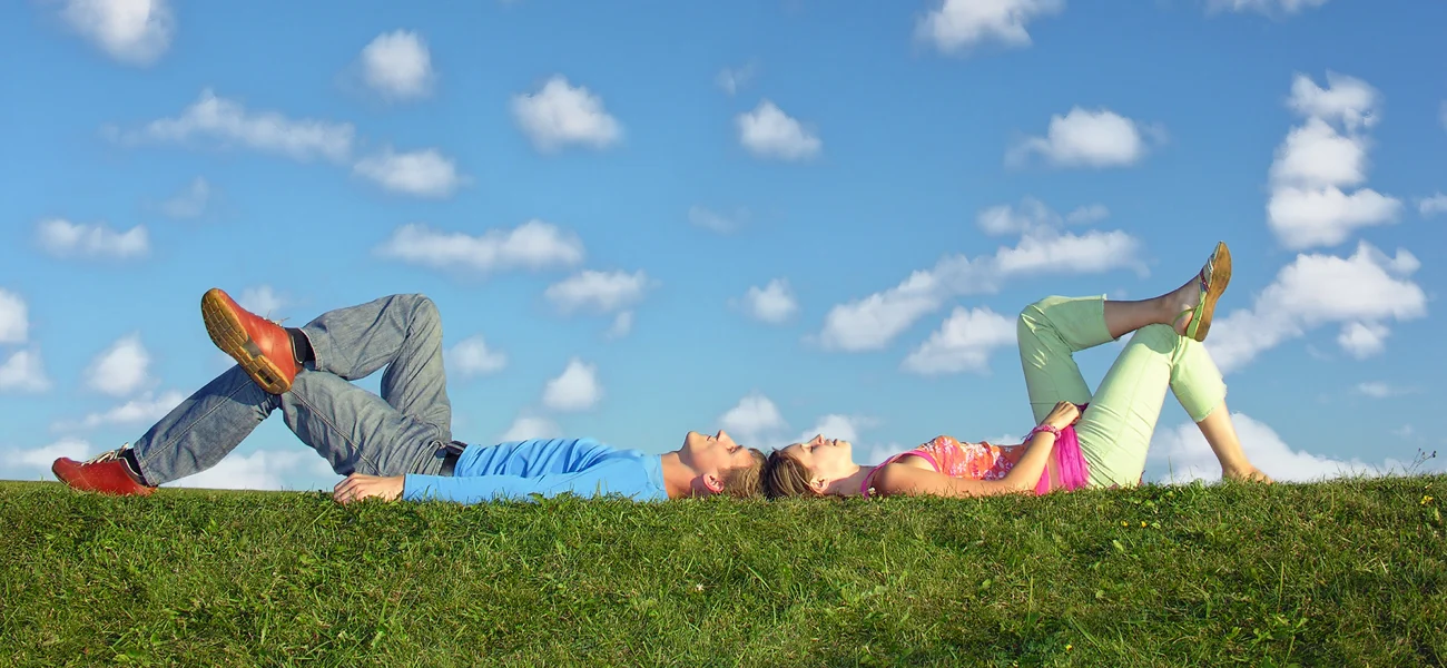 Couple laying in grass